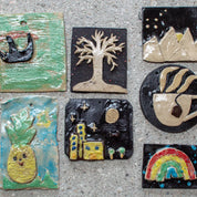 Seven ceramic tiles featuring designs like a bird, tree, mountains, pineapple, cityscape, coffee cup, and rainbow by Urchic Porcelain—ideal for sparking creativity at GLINARIJE NA LONTRGU: Poletna mala šola gline za otroke - AKONTACIJA.